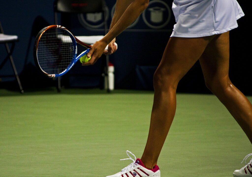 Lady playing tennis in baks Osteopathy Maidstone website