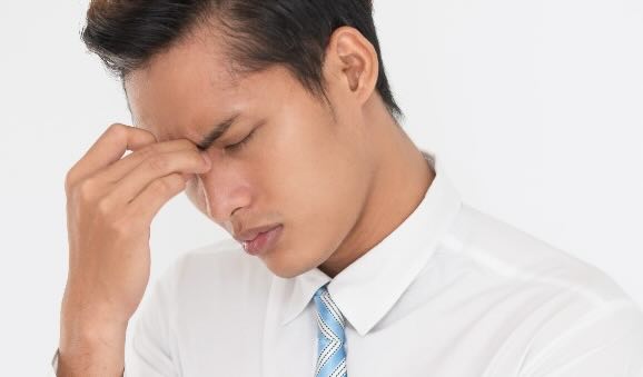 man with a tension headache
